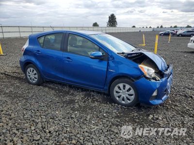 Czwarte zdjęcie samochodu z boku: 2014 TOYOTA PRIUS C TWO VIN:JTDKDTB3XE1060908 - miniatura
