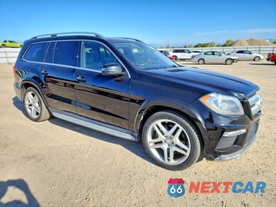 Czwarte zdjęcie samochodu z boku: 2015 MERCEDES-BENZ GL 550 4MATIC VIN:4JGDF7DE4FA532235 - miniatura