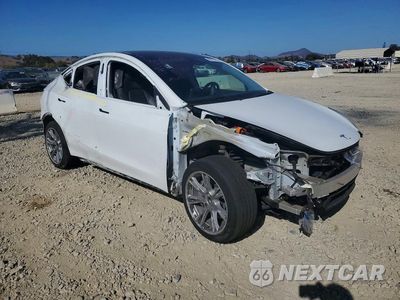 Czwarte zdjęcie samochodu z boku: 2022 TESLA MODEL Y VIN:7SAYGAEE9NF490037 - miniatura
