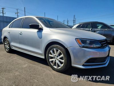 Czwarte zdjęcie samochodu z boku: 2015 VOLKSWAGEN JETTA SE VIN:3VWD17AJ6FM277690 - miniatura