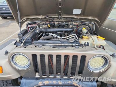 Zdjęcie 12 z 13 samochodu: 2004 JEEP WRANGLER / TJ SAHARA VIN:1J4FA59S74P716202 - miniatura