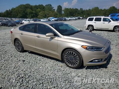 Czwarte zdjęcie samochodu z boku: 2017 FORD FUSION SE HYBRID VIN:3FA6P0LU3HR226507 - miniatura