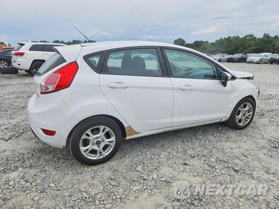 Trzecie zdjęcie samochodu z tyłu: 2014 FORD FIESTA SE VIN:3FADP4EJ2EM106997 - miniatura