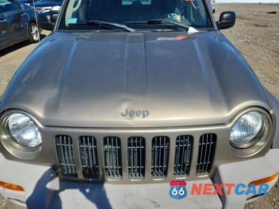 Zdjęcie 12 z 13 samochodu: 2004 JEEP LIBERTY SPORT VIN:1J4GL48K44W315710 - miniatura
