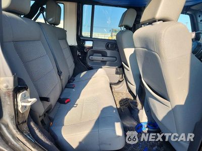 Zdjęcie 10 z 12 samochodu: 2009 JEEP WRANGLER UNLIMITED SAHARA VIN:1J4GA59149L760569 - miniatura
