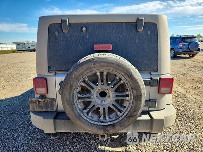 Zdjęcie 6 z 12 samochodu: 2014 JEEP WRANGLER UNLIMITED SAHARA VIN:1C4BJWEG0EL168161 - miniatura