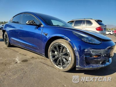 Czwarte zdjęcie samochodu z boku: 2022 TESLA MODEL 3 VIN:5YJ3E1EA5NF251157 - miniatura
