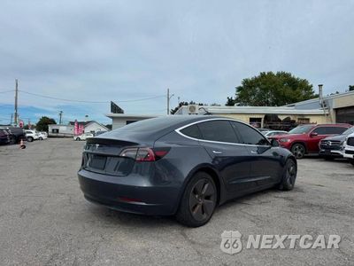 Czwarte zdjęcie samochodu z boku: 2020 TESLA MODEL 3 VIN:5YJ3E1EA6LF793932 - miniatura