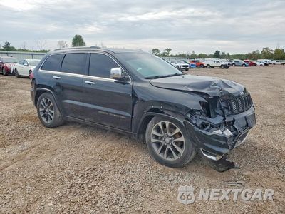Czwarte zdjęcie samochodu z boku: 2017 JEEP GRAND CHEROKEE OVERLAND VIN:1C4RJFCGXHC770135 - miniatura