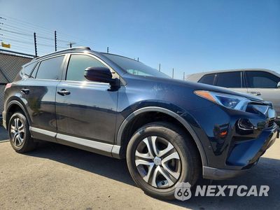 Czwarte zdjęcie samochodu z boku: 2018 TOYOTA RAV4 LE VIN:JTMZFREV0JJ176086 - miniatura