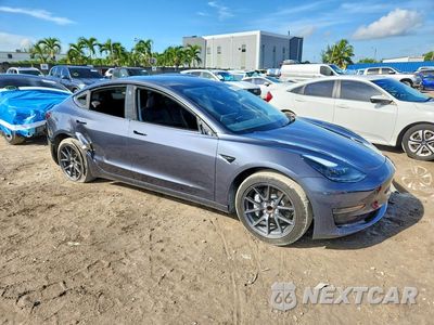 Czwarte zdjęcie samochodu z boku: 2023 TESLA MODEL 3 VIN:5YJ3E1EA0PF689183 - miniatura