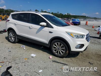 Czwarte zdjęcie samochodu z boku: 2017 FORD ESCAPE TITANIUM VIN:1FMCU0JD7HUB96277 - miniatura