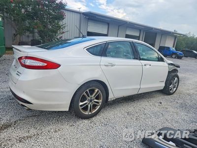 Trzecie zdjęcie samochodu z tyłu: 2016 FORD FUSION TITANIUM HEV VIN:3FA6P0RU8GR127252 - miniatura