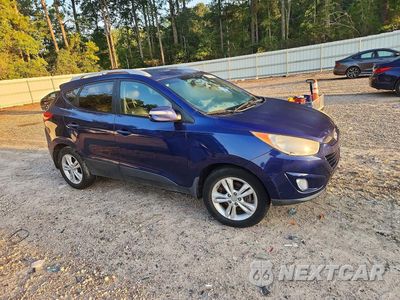 Czwarte zdjęcie samochodu z boku: 2013 HYUNDAI TUCSON GLS VIN:KM8JUCAC1DU561045 - miniatura