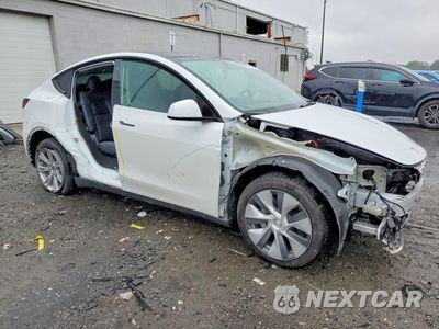 Czwarte zdjęcie samochodu z boku: 2023 TESLA MODEL Y VIN:7SAYGDEE6PA093581 - miniatura