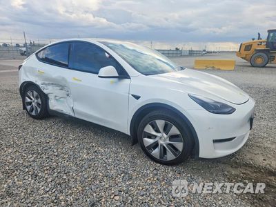 Czwarte zdjęcie samochodu z boku: 2023 TESLA MODEL Y VIN:7SAYGDEE5PF843779 - miniatura