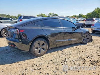 Trzecie zdjęcie samochodu z tyłu: 2023 TESLA MODEL 3 VIN:5YJ3E1EA2PF512313 - miniatura