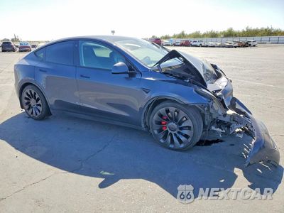 Czwarte zdjęcie samochodu z boku: 2022 TESLA MODEL Y VIN:7SAYGDEF7NF574383 - miniatura
