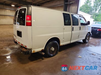 Trzecie zdjęcie samochodu z tyłu: 2014 CHEVROLET EXPRESS G1500 VIN:1GCSHAF40E1124725 - miniatura