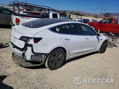 Trzecie zdjęcie samochodu z tyłu: 2018 TESLA MODEL 3 VIN:5YJ3E1EB2JF115636 - miniatura