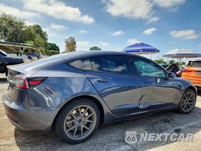 Trzecie zdjęcie samochodu z tyłu: 2020 TESLA MODEL 3 VIN:5YJ3E1EA8LF705107 - miniatura