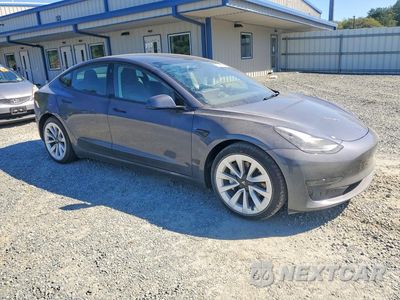 Czwarte zdjęcie samochodu z boku: 2023 TESLA MODEL 3 VIN:5YJ3E1EA2PF549037 - miniatura