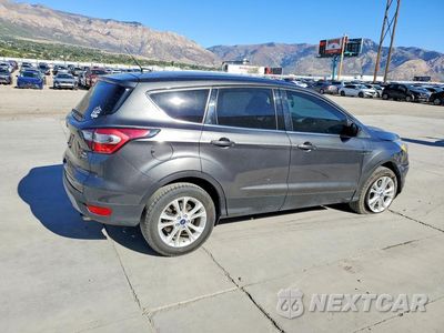 Trzecie zdjęcie samochodu z tyłu: 2017 FORD ESCAPE SE VIN:1FMCU9GD8HUE73109 - miniatura