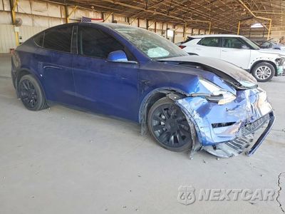 Czwarte zdjęcie samochodu z boku: 2023 TESLA MODEL Y VIN:7SAYGDEE9PA204141 - miniatura