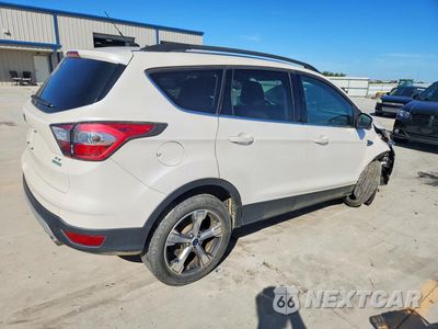 Trzecie zdjęcie samochodu z tyłu: 2017 FORD ESCAPE SE VIN:1FMCU0G99HUA78749 - miniatura