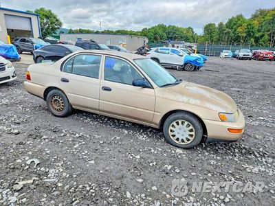 Czwarte zdjęcie samochodu z boku: 1995 TOYOTA COROLLA BASE VIN:2T1AE04B1SC077132 - miniatura