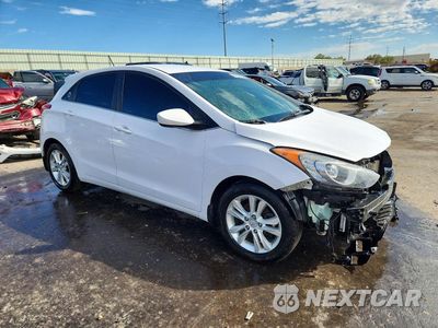 Czwarte zdjęcie samochodu z boku: 2014 HYUNDAI ELANTRA GT BASE VIN:KMHD35LH7EU171508 - miniatura