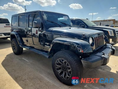 Czwarte zdjęcie samochodu z boku: 2017 JEEP WRANGLER UNLIMITED SAHARA VIN:1C4BJWEG3HL696314 - miniatura