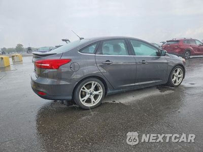 Trzecie zdjęcie samochodu z tyłu: 2016 FORD FOCUS TITANIUM VIN:1FADP3J25GL249567 - miniatura