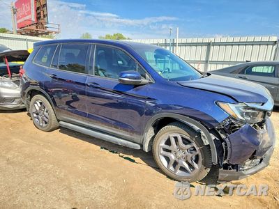 Czwarte zdjęcie samochodu z boku: 2023 HONDA PASSPORT EXL VIN:5FNYF8H5XPB030652 - miniatura