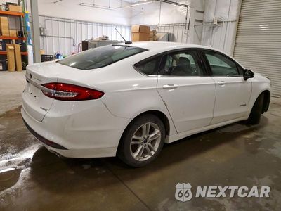 Trzecie zdjęcie samochodu z tyłu: 2018 FORD FUSION S HYBRID VIN:3FA6P0UU5JR122721 - miniatura