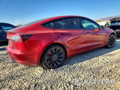 Trzecie zdjęcie samochodu z tyłu: 2022 TESLA MODEL 3 VIN:5YJ3E1EC0NF242044 - miniatura