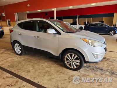 Czwarte zdjęcie samochodu z boku: 2013 HYUNDAI TUCSON LIMITED VIN:KM8JUCAC8DU745141 - miniatura