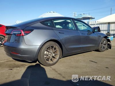 Trzecie zdjęcie samochodu z tyłu: 2023 TESLA MODEL 3 VIN:5YJ3E1EA9PF426996 - miniatura