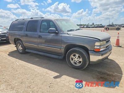 Czwarte zdjęcie samochodu z boku: 2001 CHEVROLET SUBURBAN C1500 VIN:3GNEC16T71G136408 - miniatura