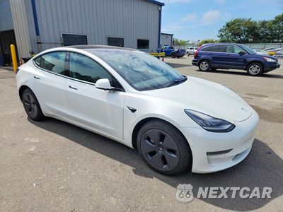 Czwarte zdjęcie samochodu z boku: 2021 TESLA MODEL 3 VIN:5YJ3E1EA0MF851972 - miniatura
