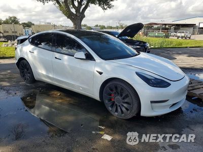 Czwarte zdjęcie samochodu z boku: 2023 TESLA MODEL 3 VIN:5YJ3E1EC8PF499813 - miniatura