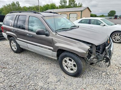 Czwarte zdjęcie samochodu z boku: 2000 JEEP GRAND CHEROKEE LAREDO VIN:1J4GW48S7YC419025 - miniatura