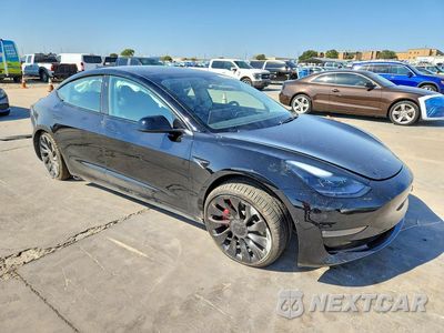 Czwarte zdjęcie samochodu z boku: 2022 TESLA MODEL 3 VIN:5YJ3E1EC6NF296786 - miniatura