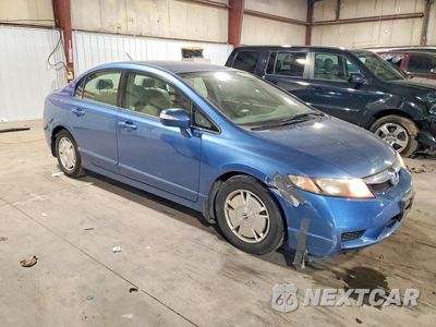 Czwarte zdjęcie samochodu z boku: 2010 HONDA CIVIC HYBRID VIN:JHMFA3F22AS001589 - miniatura