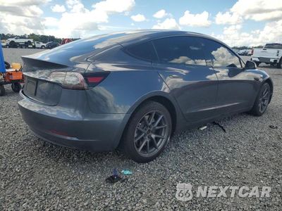 Trzecie zdjęcie samochodu z tyłu: 2021 TESLA MODEL 3 VIN:5YJ3E1EA4MF087642 - miniatura