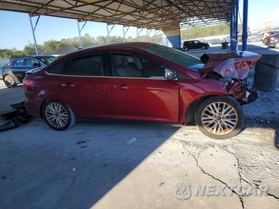 Czwarte zdjęcie samochodu z boku: 2016 FORD FOCUS TITANIUM VIN:1FADP3J28GL287763 - miniatura