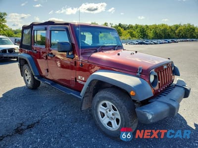 Czwarte zdjęcie samochodu z boku: 2009 JEEP WRANGLER UNLIMITED X VIN:1J4GZ39149L726984 - miniatura