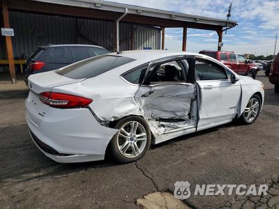 Trzecie zdjęcie samochodu z tyłu: 2018 FORD FUSION SE HYBRID VIN:3FA6P0LU7JR207741 - miniatura