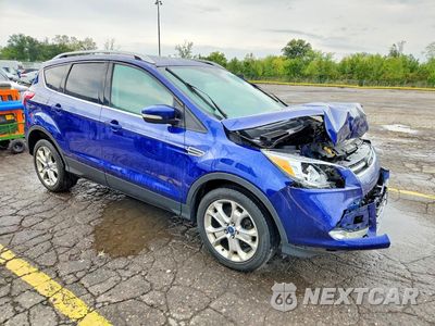 Czwarte zdjęcie samochodu z boku: 2014 FORD ESCAPE TITANIUM VIN:1FMCU0J93EUB14410 - miniatura