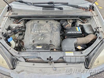 Zdjęcie 12 z 13 samochodu: 2007 HYUNDAI TUCSON SE VIN:KM8JN72D17U642191 - miniatura